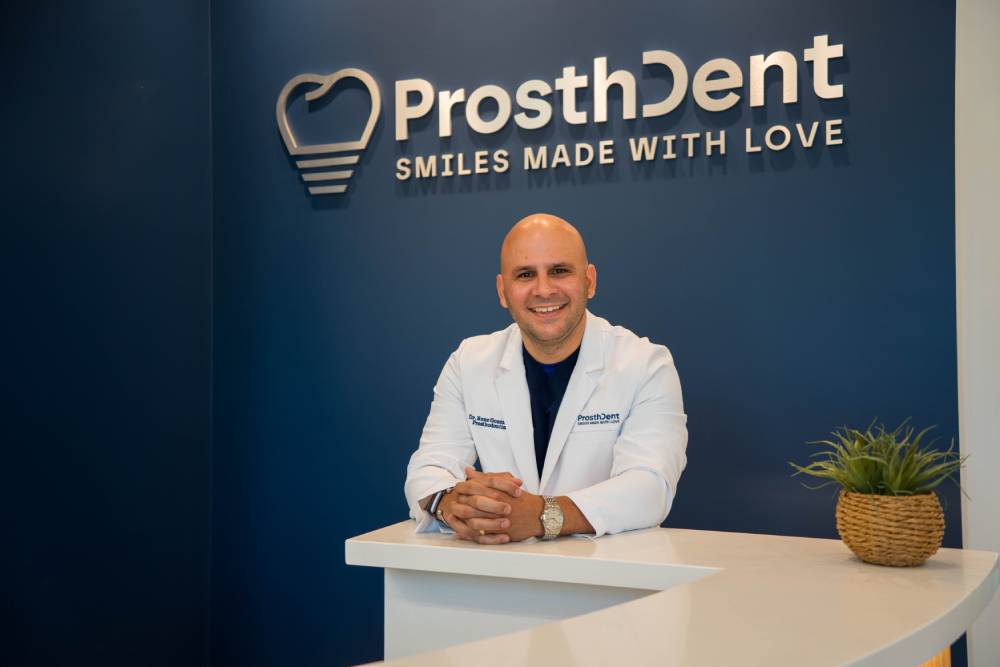 Dr. Rene Gonzalez: Founder of ProsthDent Dr. René González, prosthodontist and founder of ProsthDent wearing a lab coat